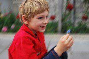 Boy Child Happy wuth flowers