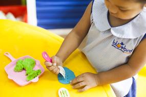 Children Playing with plasticine