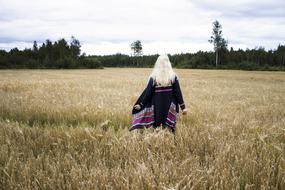 girl walking in a field