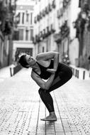 girl doing yoga in the street