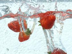 delicious berries in water