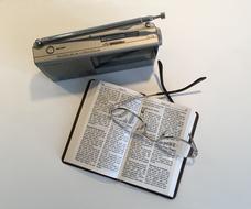old radio with a book on the table