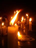burning wax candles on the table