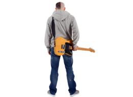 photo of a young man with a guitar from the back