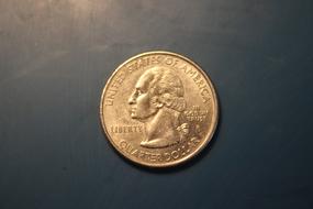 gold coin with a face