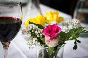 decorative bouquet of flowers near the wine