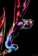 water colored paints on a black background