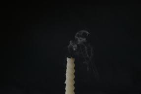 smoking Candle at darkness
