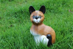 Wooden Cat Figure on grass