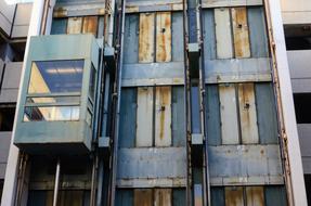 external Elevator on wall of industrial building