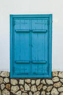 closed Window with Old Wooden blue shutters, cyprus, paralimni