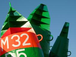 green signs by the seashore
