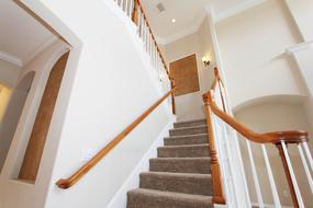 gray carpet on the stairs in a white building