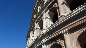 Roman building against a blue background