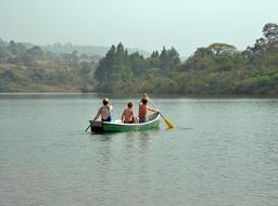 children on a boat on a lake in africa