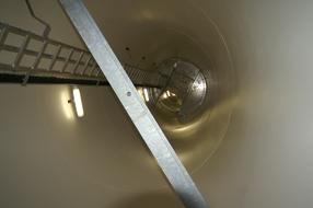 Interior of the windmill, with the ladder and lights