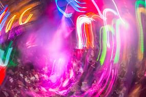 crowd of People on Party and colorful light traces