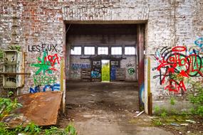 bright graffiti on an abandoned brick factory