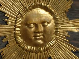 golden sun with a face