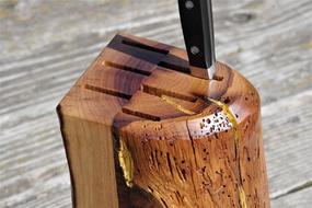 knife stuck in a wooden holder