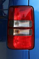 red headlight on the background of a blue car