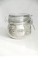 white sand in a glass jar