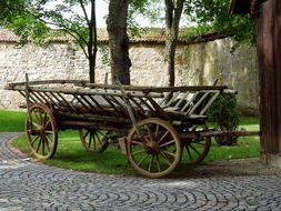 an old cart by the fence