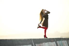 long haired young girl in Red Stockings