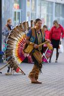 artist in national costume on a city street