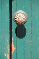 green metal door handle