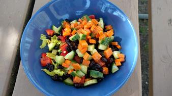 sliced vegetables in blue plate