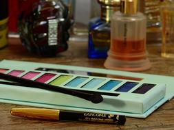 cosmetics with perfume on the table