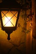 burning lantern in the street at night