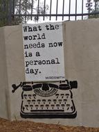 typewriter with a signature on the wall