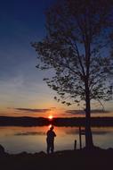 Fisherman Silhouette on Shore