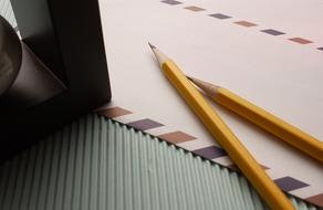 wooden pencils on writing