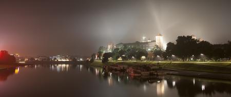 distant view of wawel castle in night illumination