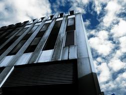 modern skyscraper against a cloudy sky