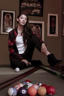 beautiful girl at the billiard table