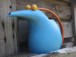 funny blue watering can for the garden