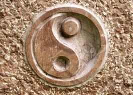 wooden carved yin yang sign