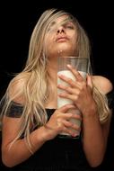 Blonde girl drinking milk