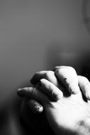 hand to hand black and white photo