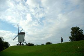 old windmill on the green hill