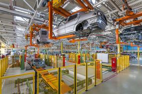 Interior of the colorful factory with vehicles