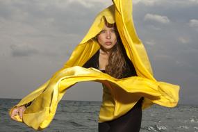 Beautiful girl Model with yellow fabric Portrait