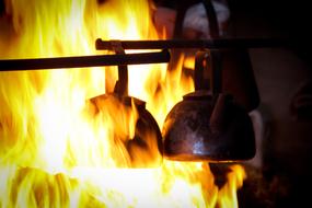 kettles on a burning fire