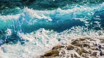 sea waves splashing against the rocks