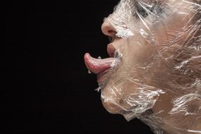 woman face in platic bag