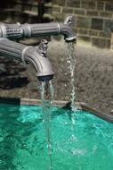 clear water from an iron faucet